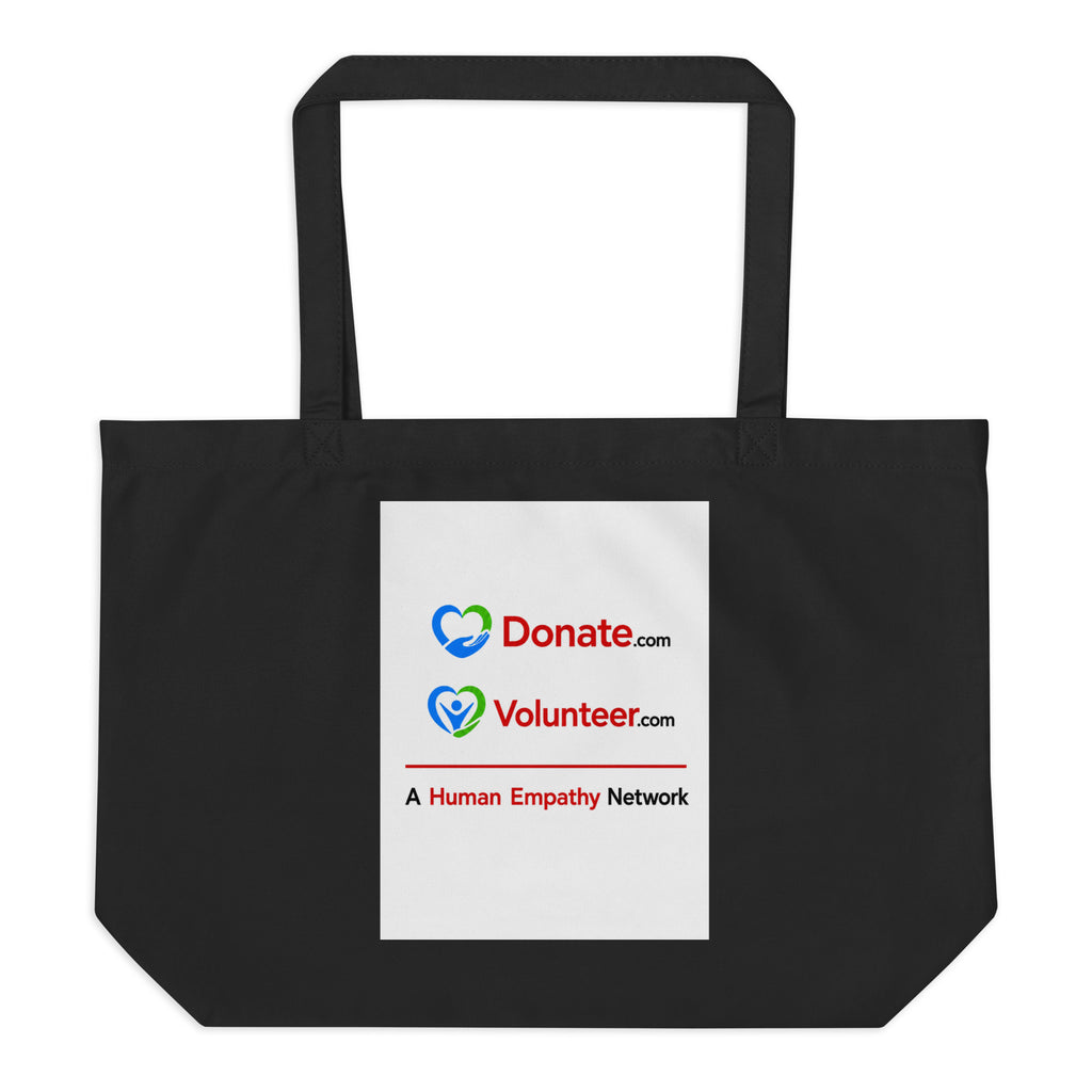A black canvas tote bag with two shoulder straps, featuring a white rectangular printed panel on the front with the Donate.com and Volunteer.com logos and A Human Empathy Network description
