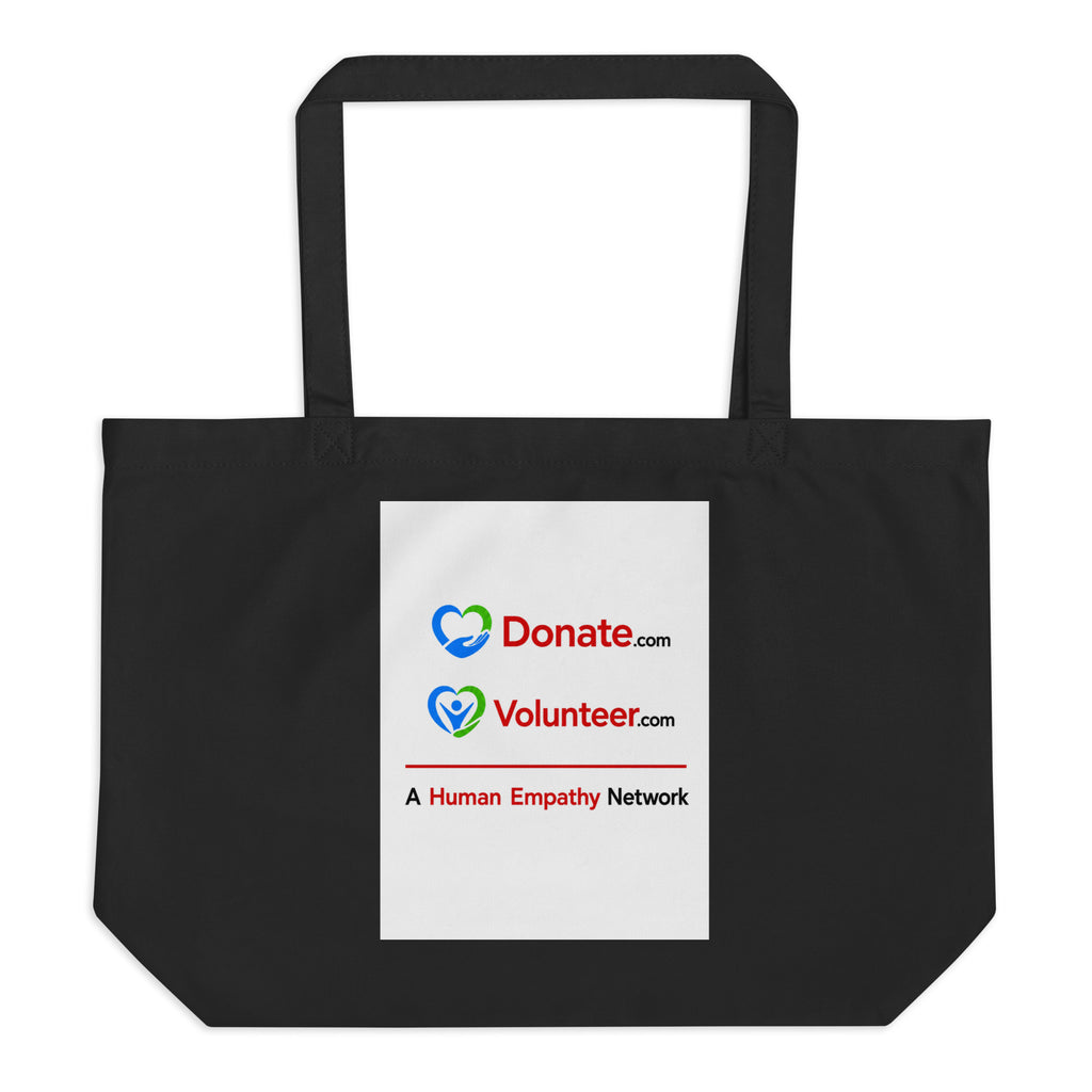 A black canvas tote bag with two shoulder straps, featuring a white rectangular printed panel on the front with the Donate.com and Volunteer.com logos and A Human Empathy Network description
