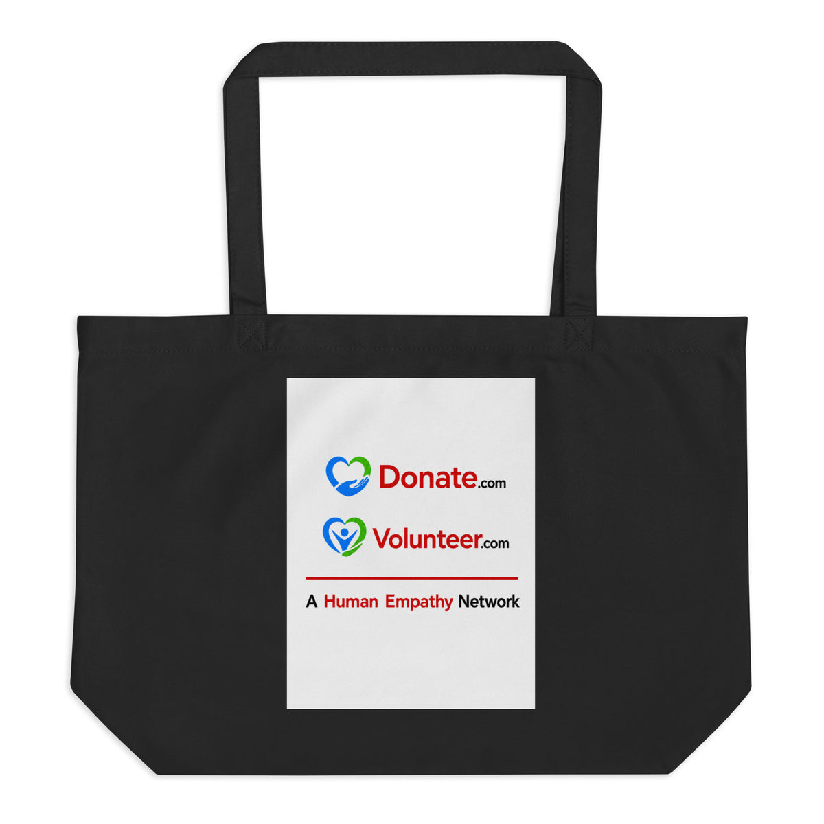 A black canvas tote bag with two shoulder straps, featuring a white rectangular printed panel on the front with the Donate.com and Volunteer.com logos and A Human Empathy Network description