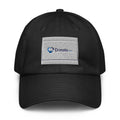 A black baseball cap with an embroidered patch on the front featuring the blue and white 'Donate.com' logo